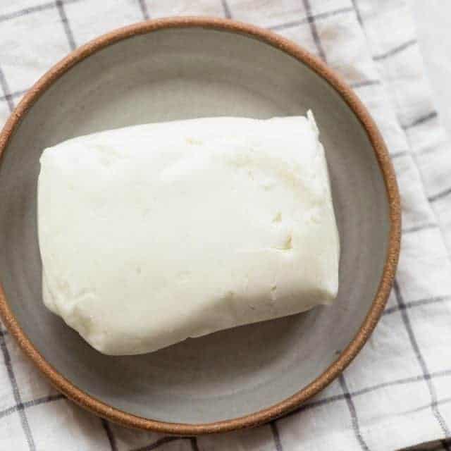 Block of halloumi cheese before cutting it