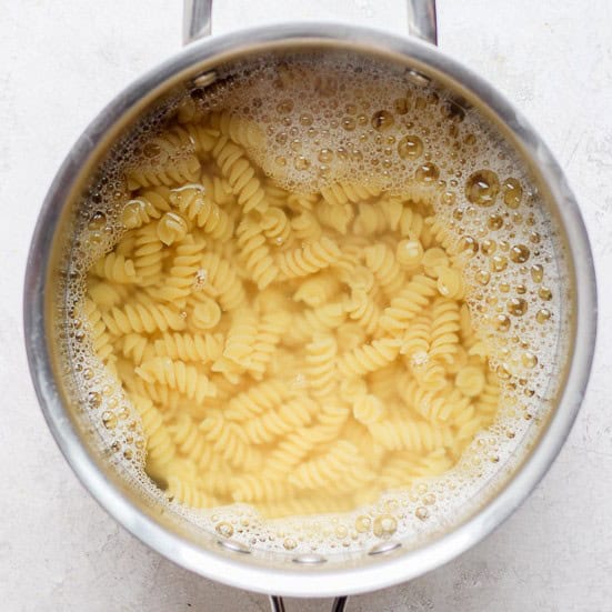 Pasta in a pot of water.