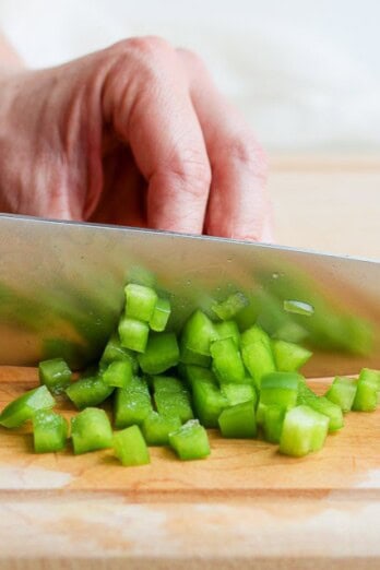 Cutting strips into smaller pieces.