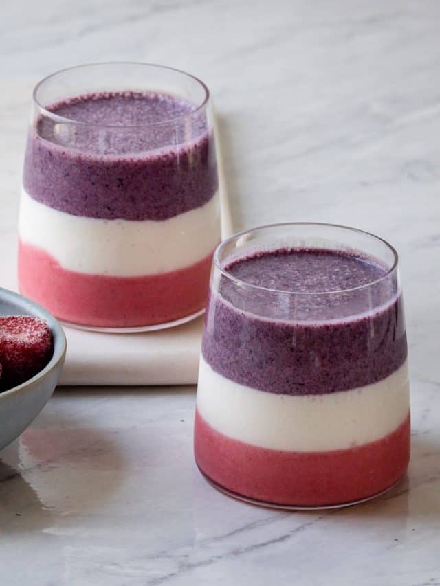 Mixed layered berry smoothie with purple, white and pink layers