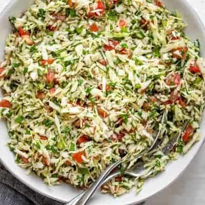 Large bowl of Lebanese cabbage salad with tomatoes and cilantro