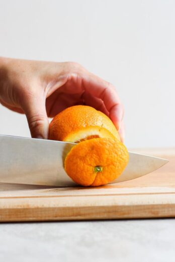 Cutting to top off an orange
