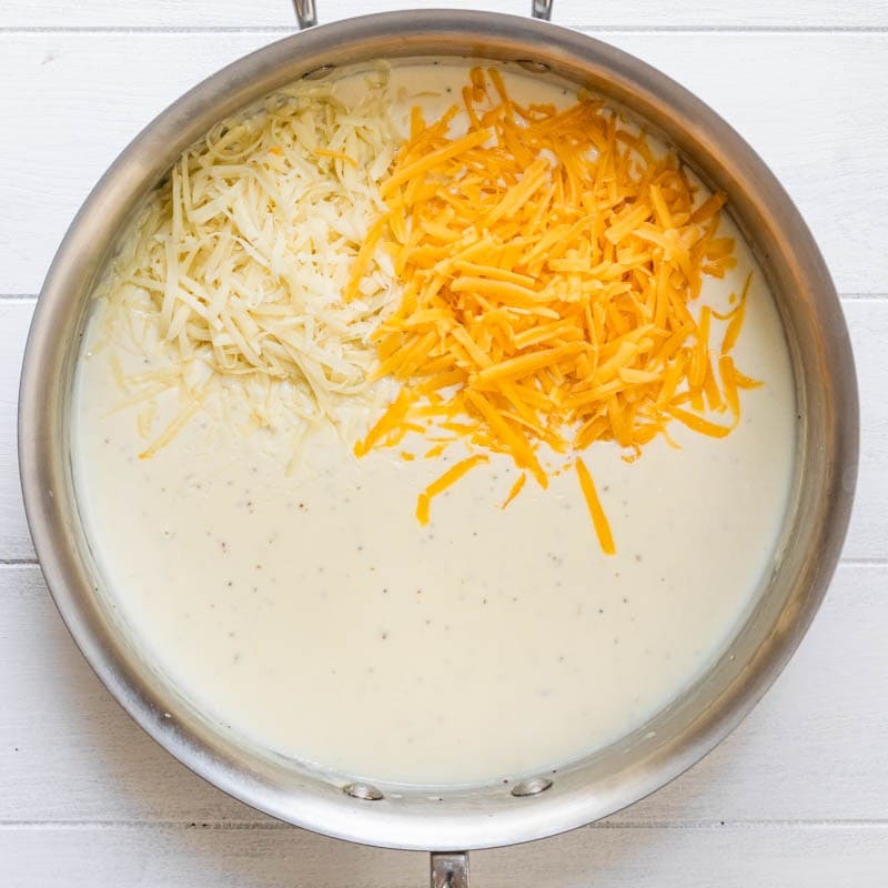 Cheese added to the pot.