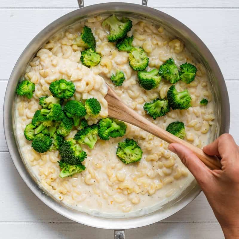 Stirring in broccoli.