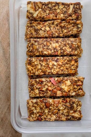 Caramel apple granola bars lined up on parchment paper