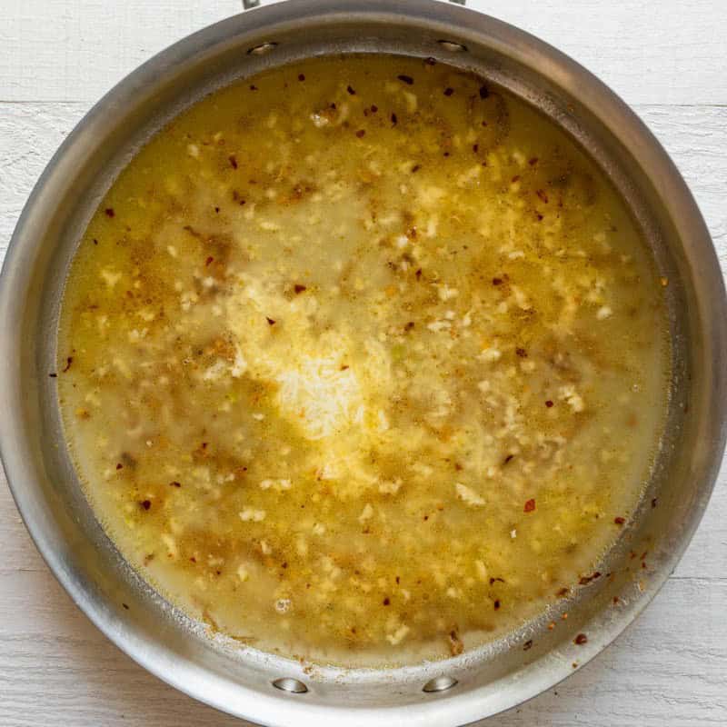 Garlic butter sauce in pan before adding pasta.