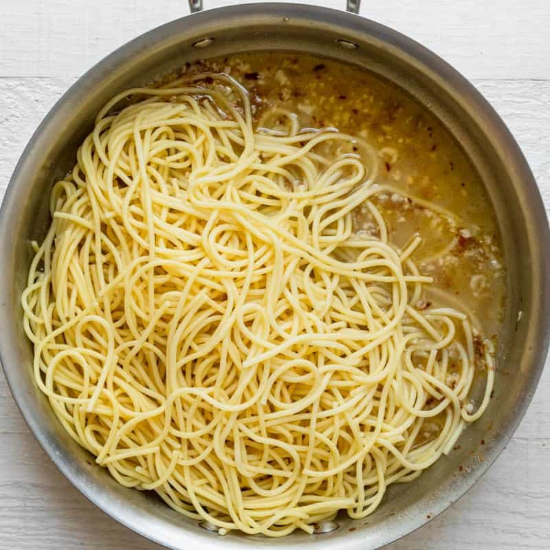 Pasta added on top of the garlic butter.