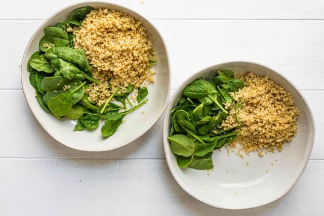 Two bowls of quinoa and spinach