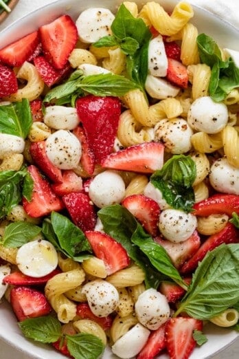 Strawberry caprese salad in a large serving bowl after fully assembled.