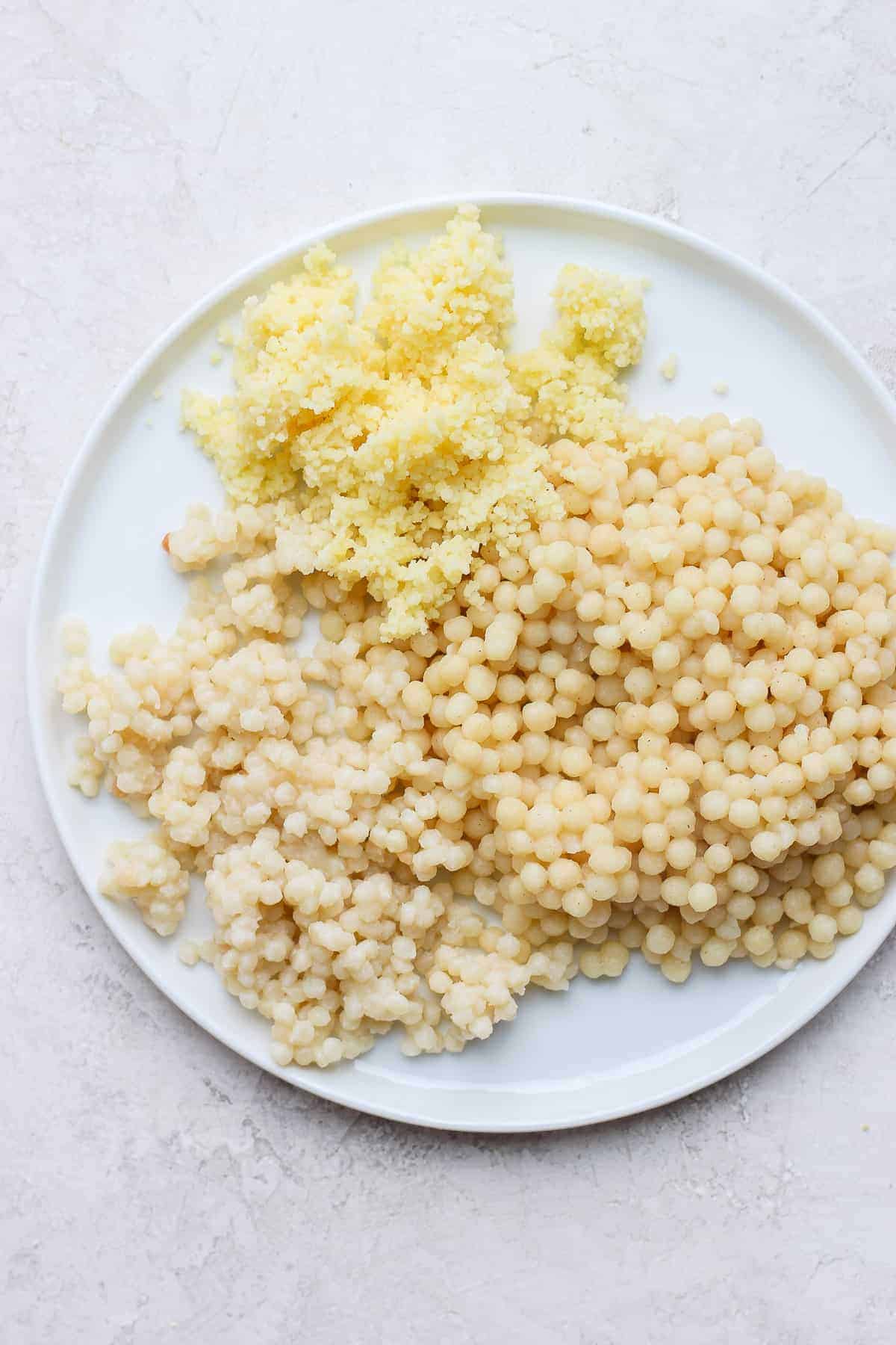 Three types of couscous on a white plate after cooking