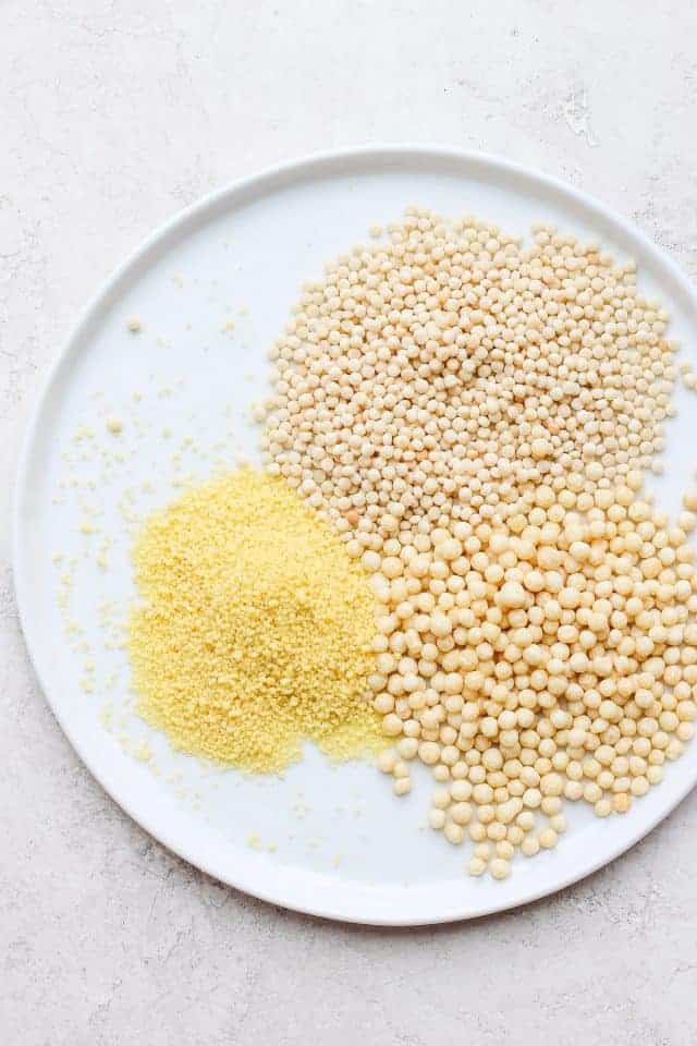 Three types of couscous on a white plate before cooking