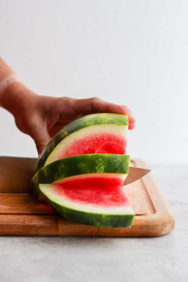 Slicing watermelon into wedges
