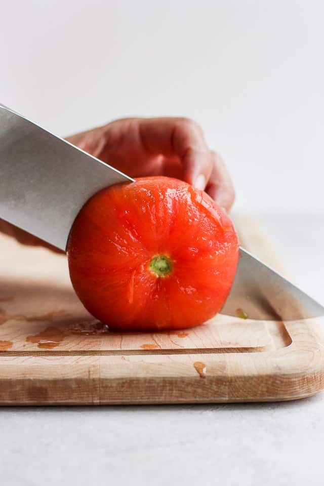 Cutting tomato in half