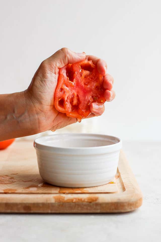 Removing seeds and juice from tomato