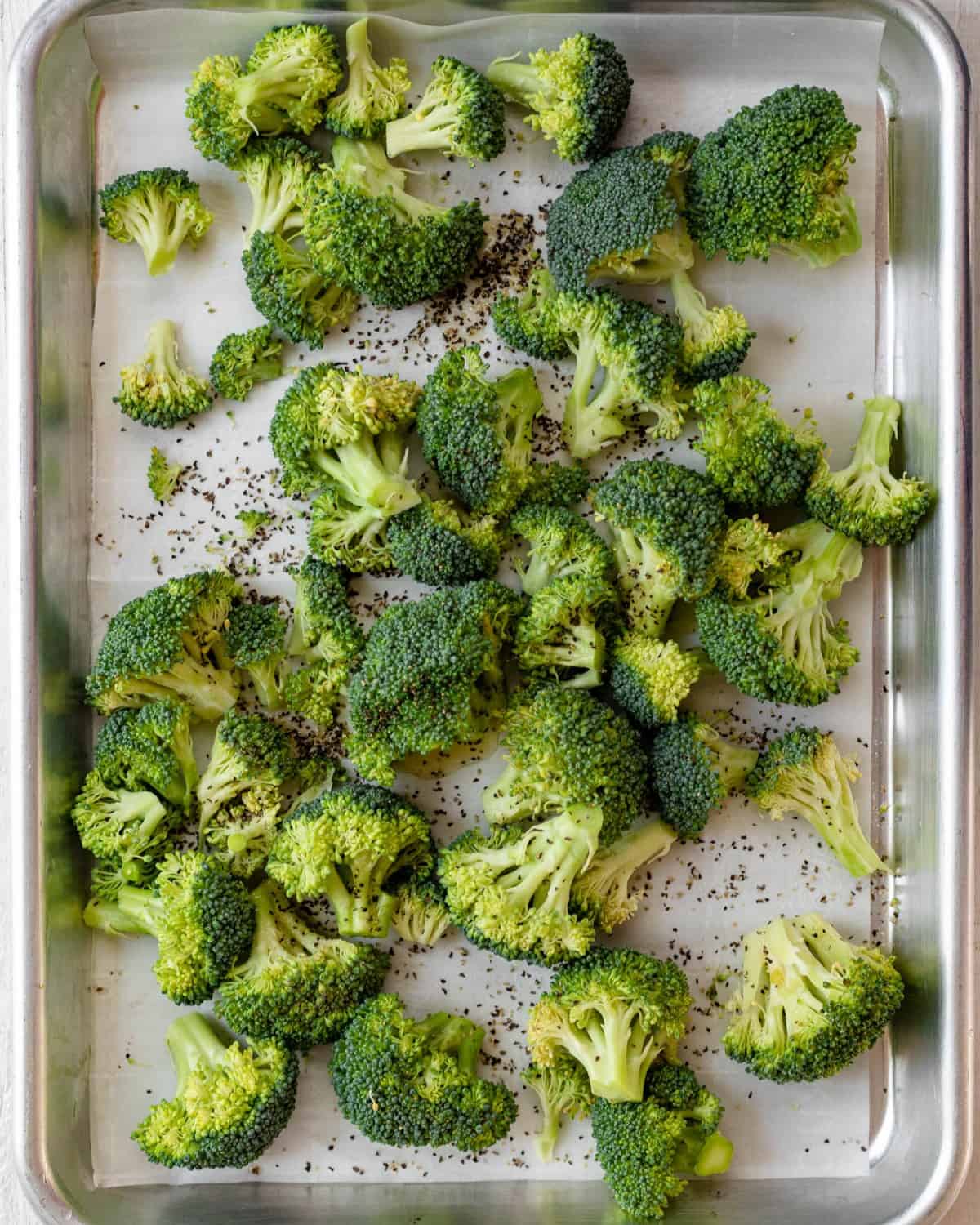 Broccoli on a baking sheet.