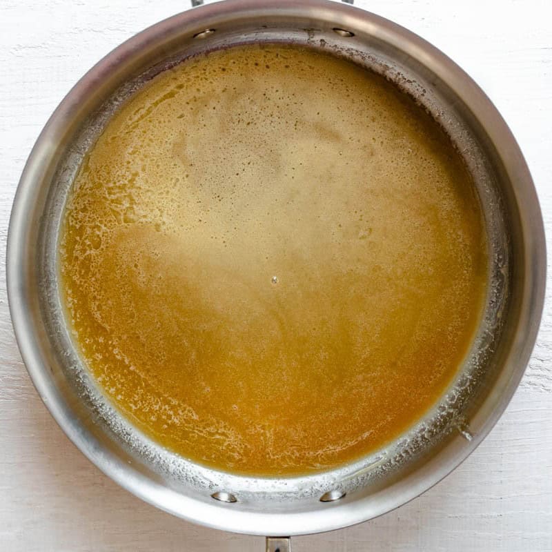 Honey, butter and brown sugar in a pot after melting.