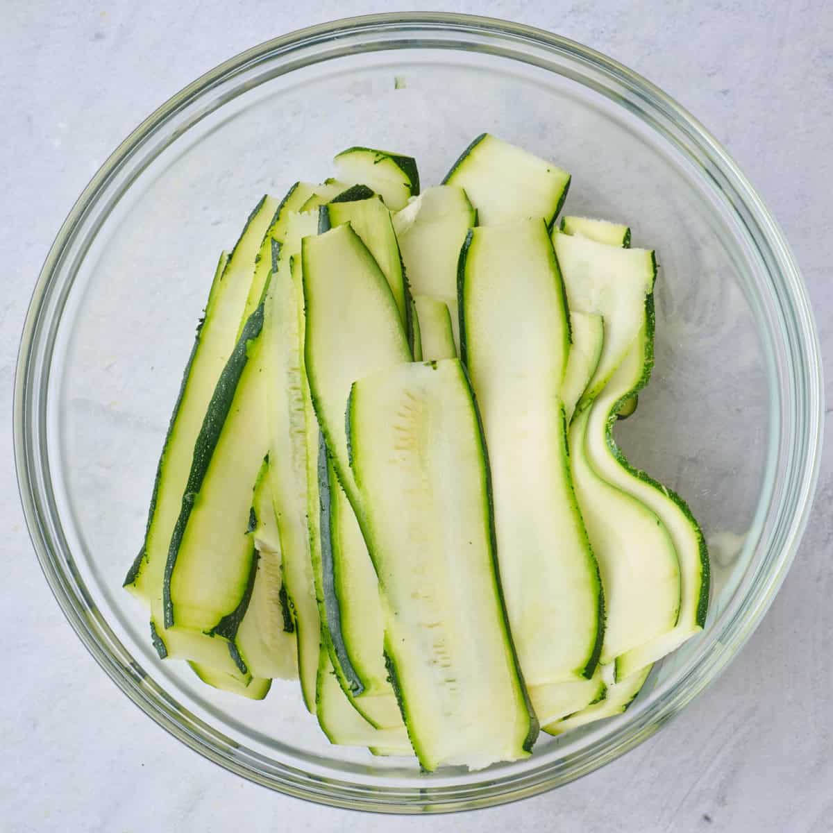 Bowl of sliced zucchini.