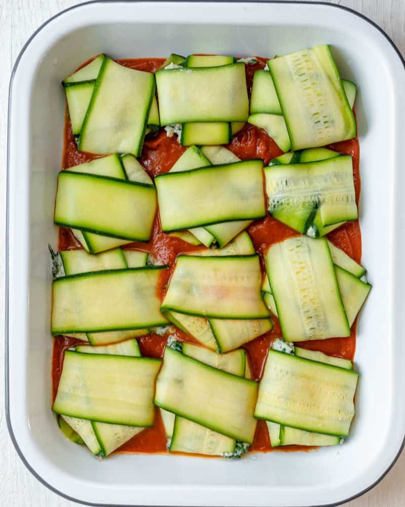 All of the zucchini ravioli pieces on top of the sauce.
