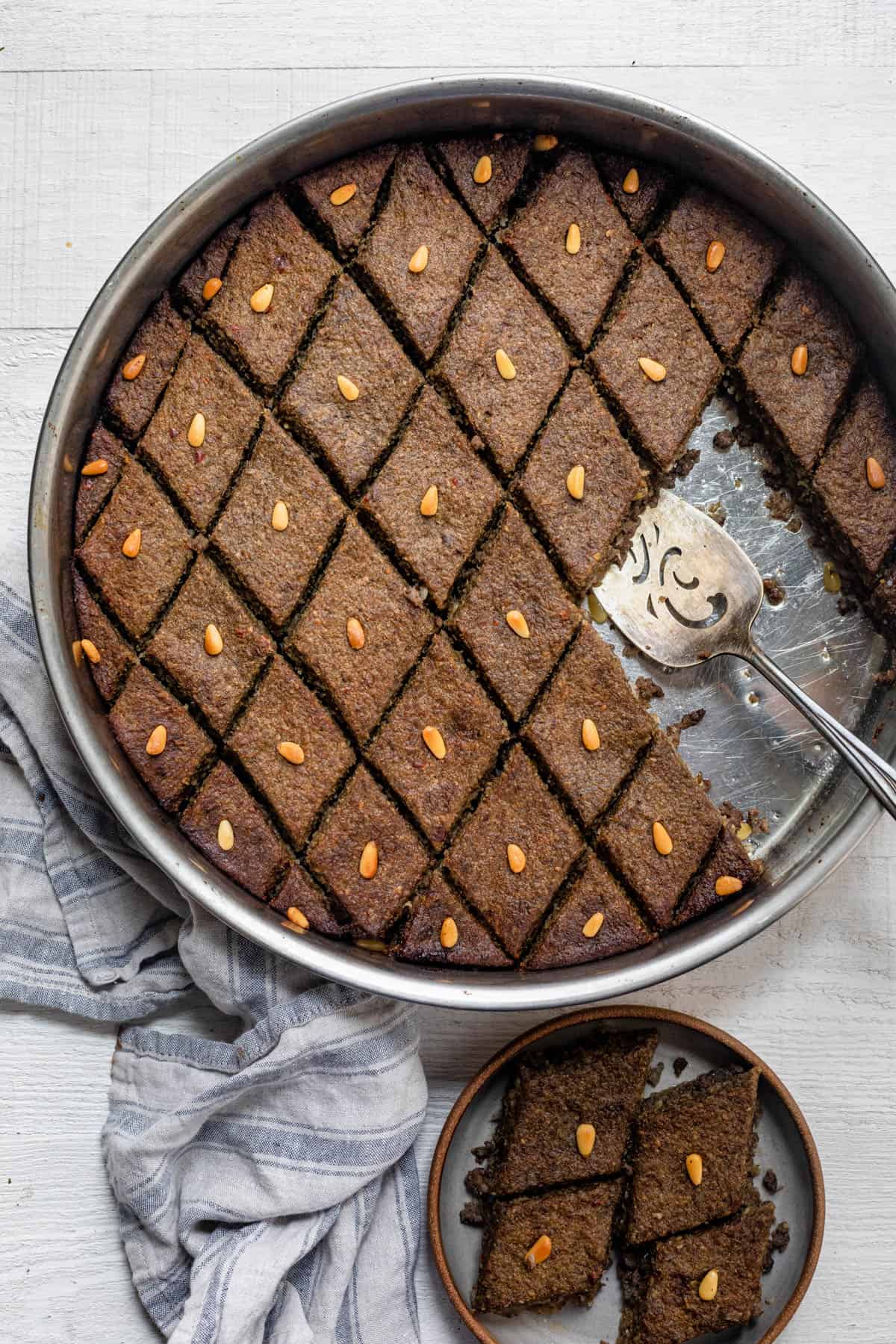 Baked kibbeh Lebanese recipe in a round metal baking dish