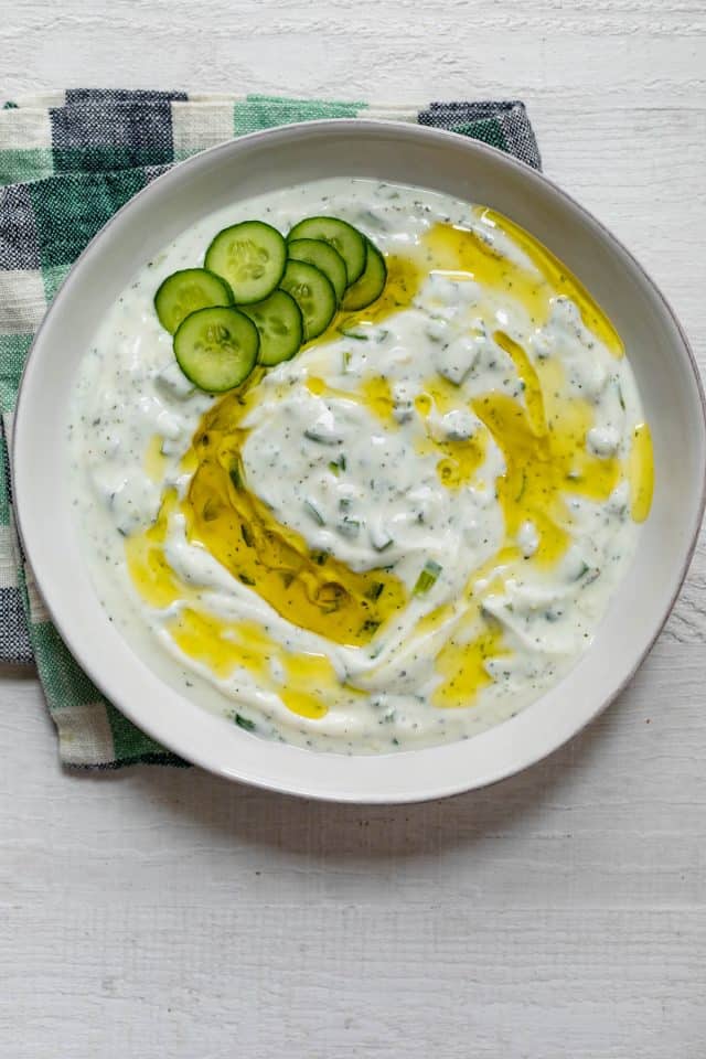 Cucumber yogurt sauce for serving with Lebanese dishes in a large bowl
