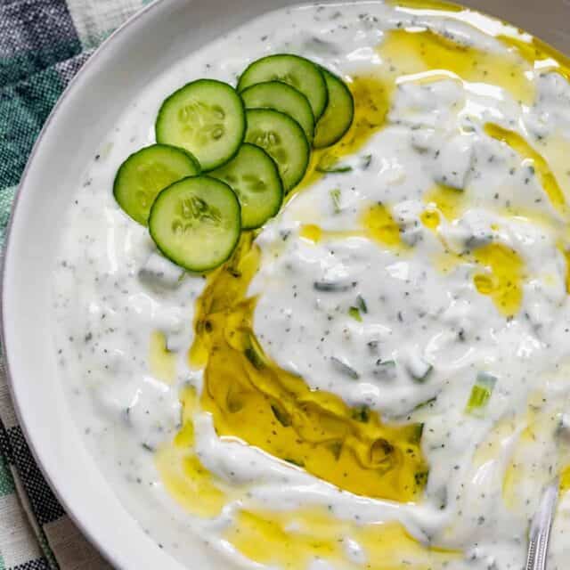 Large bowl of Lebanese yogurt sauce drizzled with olive oil