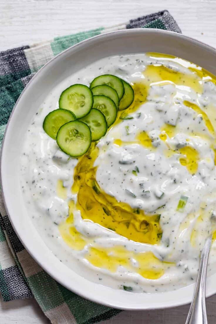 Large bowl of Lebanese yogurt sauce drizzled with olive oil