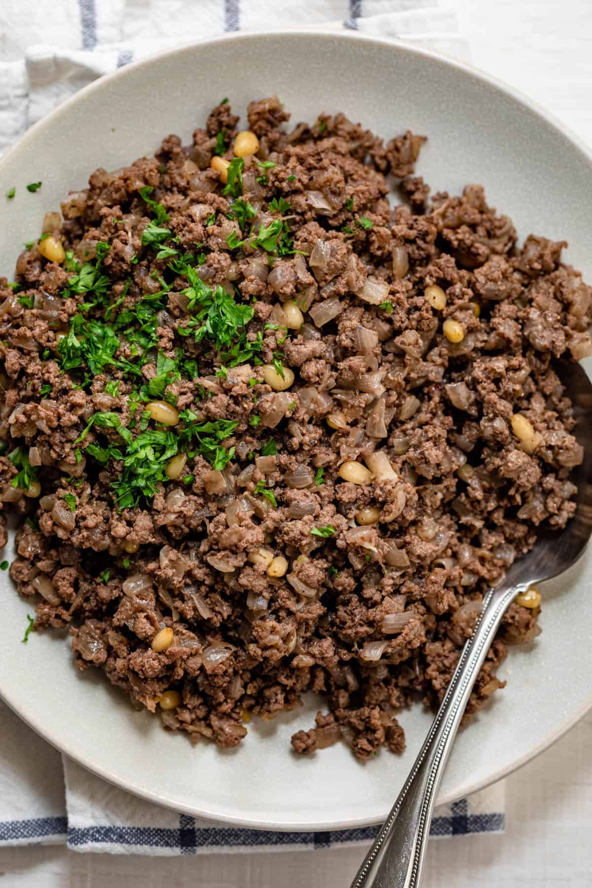 Lebanese hashweh with spoon scooping out serving