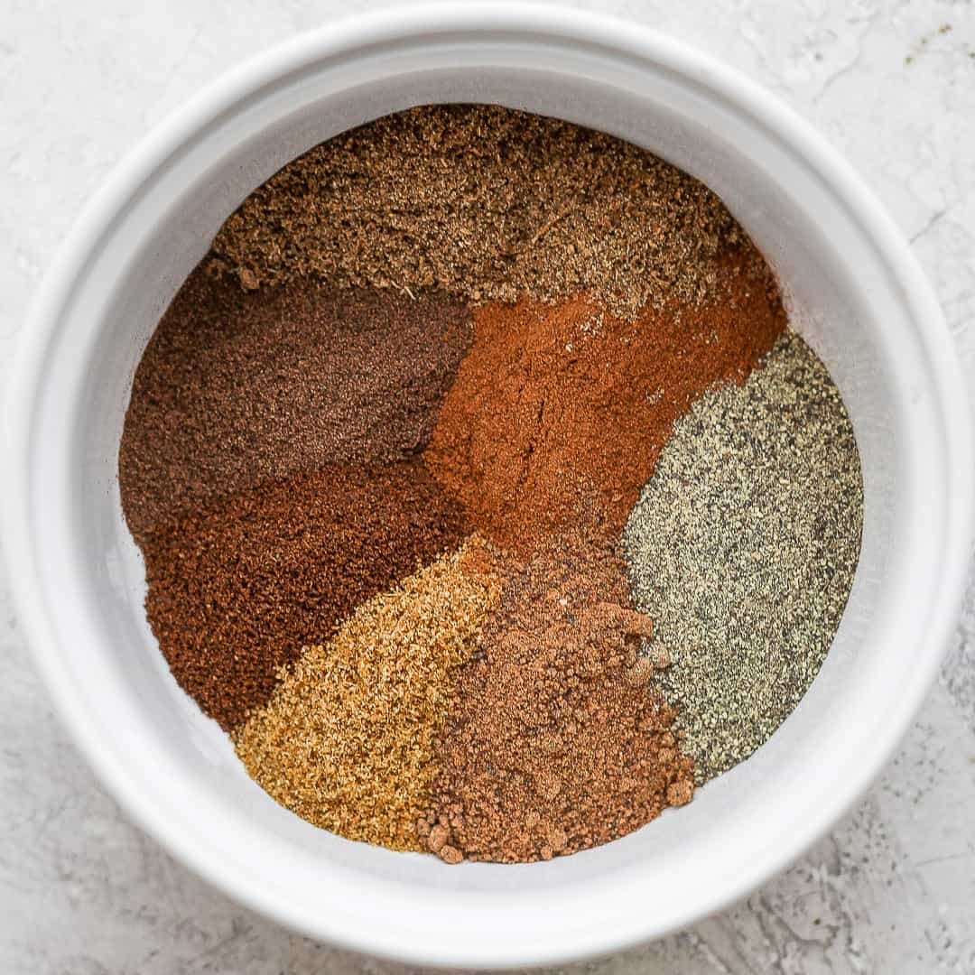 The ingredients to make seven spice in a bowl before mixing.