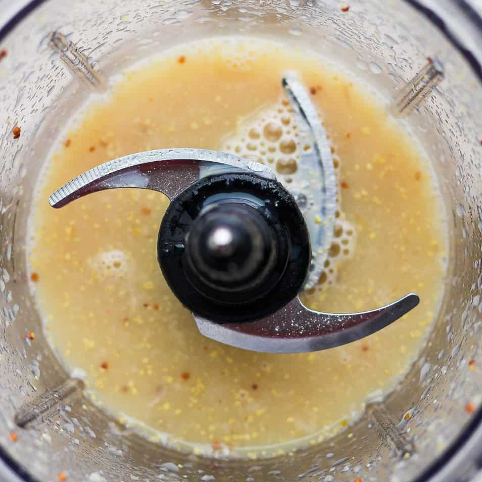 Ingredients for emulsified dressing in a processor after combining.