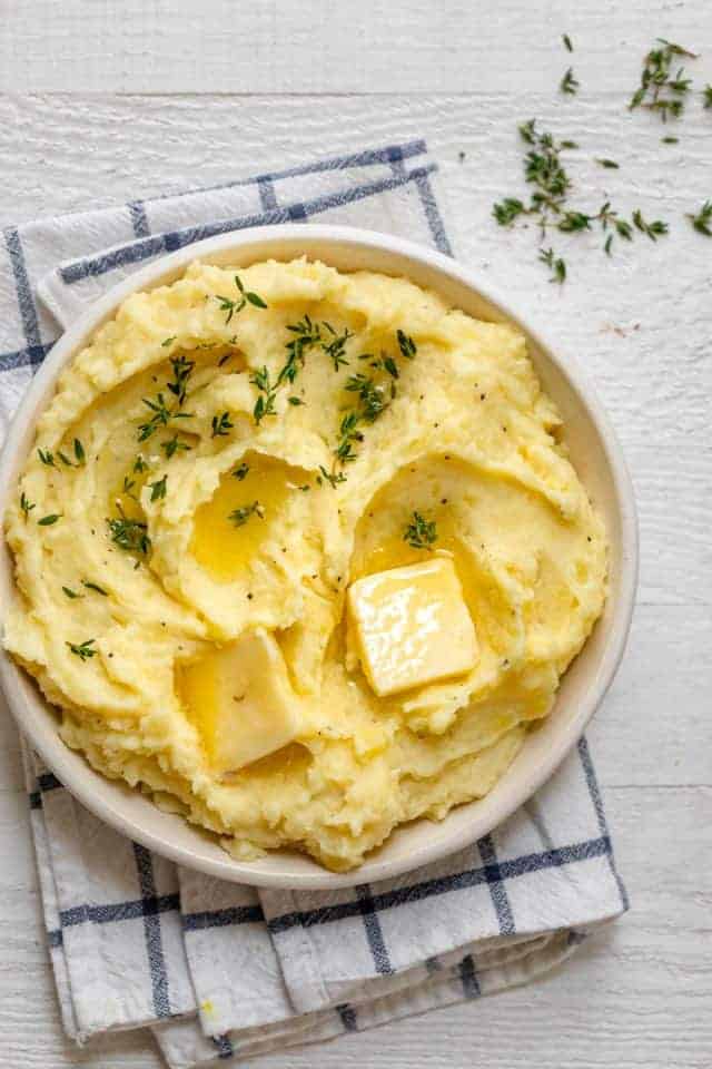 Final instant pot mashed potatoes served with extra butter