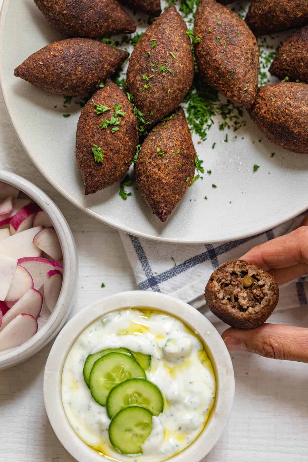 Showing the inside of the kibbeh after biting into one