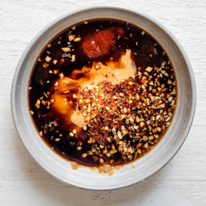 Ingredients for sauce in bowl before mixing.