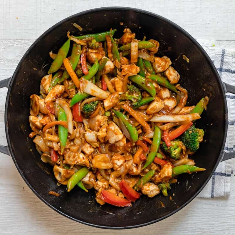 After combining the sauce and the chicken with vegetables.