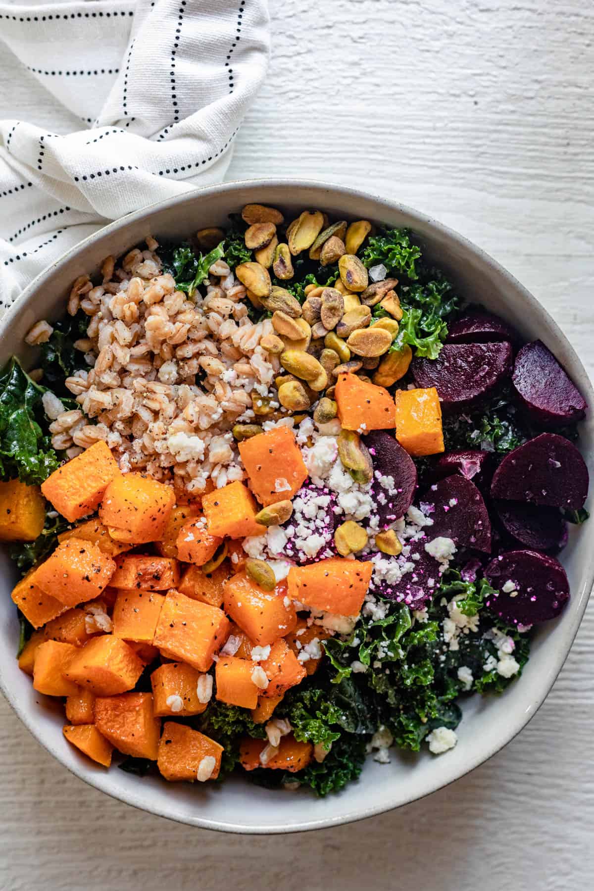 Vegetarian fall grain bowl loaded with grains and vegetables