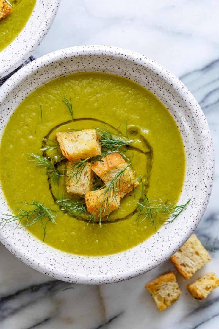 Large bowl of vegan broccoli soup with croutons on top