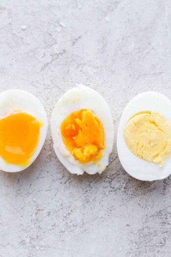 3 boiled eggs, soft, medium and hard - sliced in half to show consistency