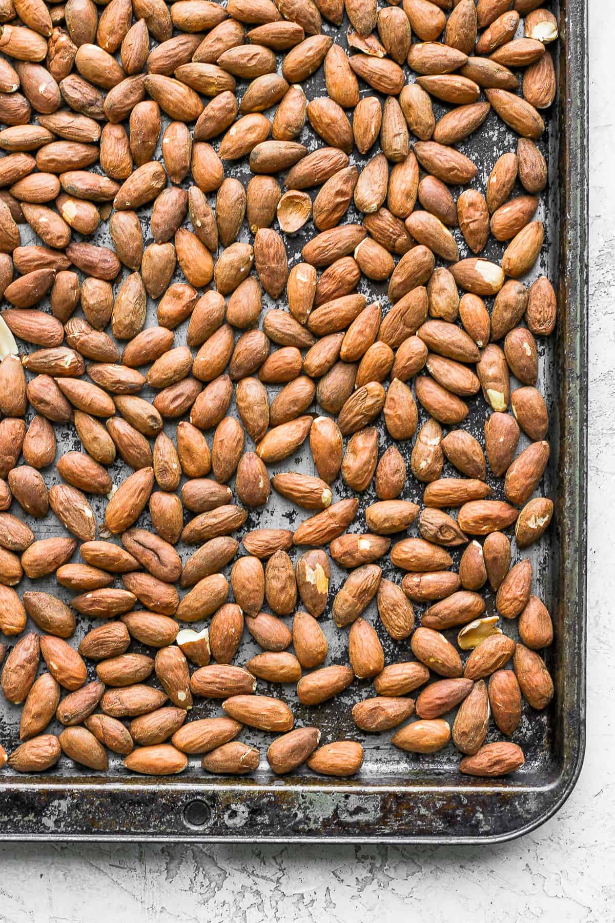 Almonds on a tray before roasting