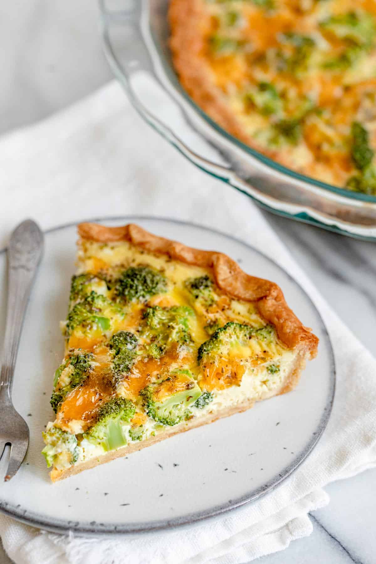 Angled view of the broccoli and cheese quiche to show the texture