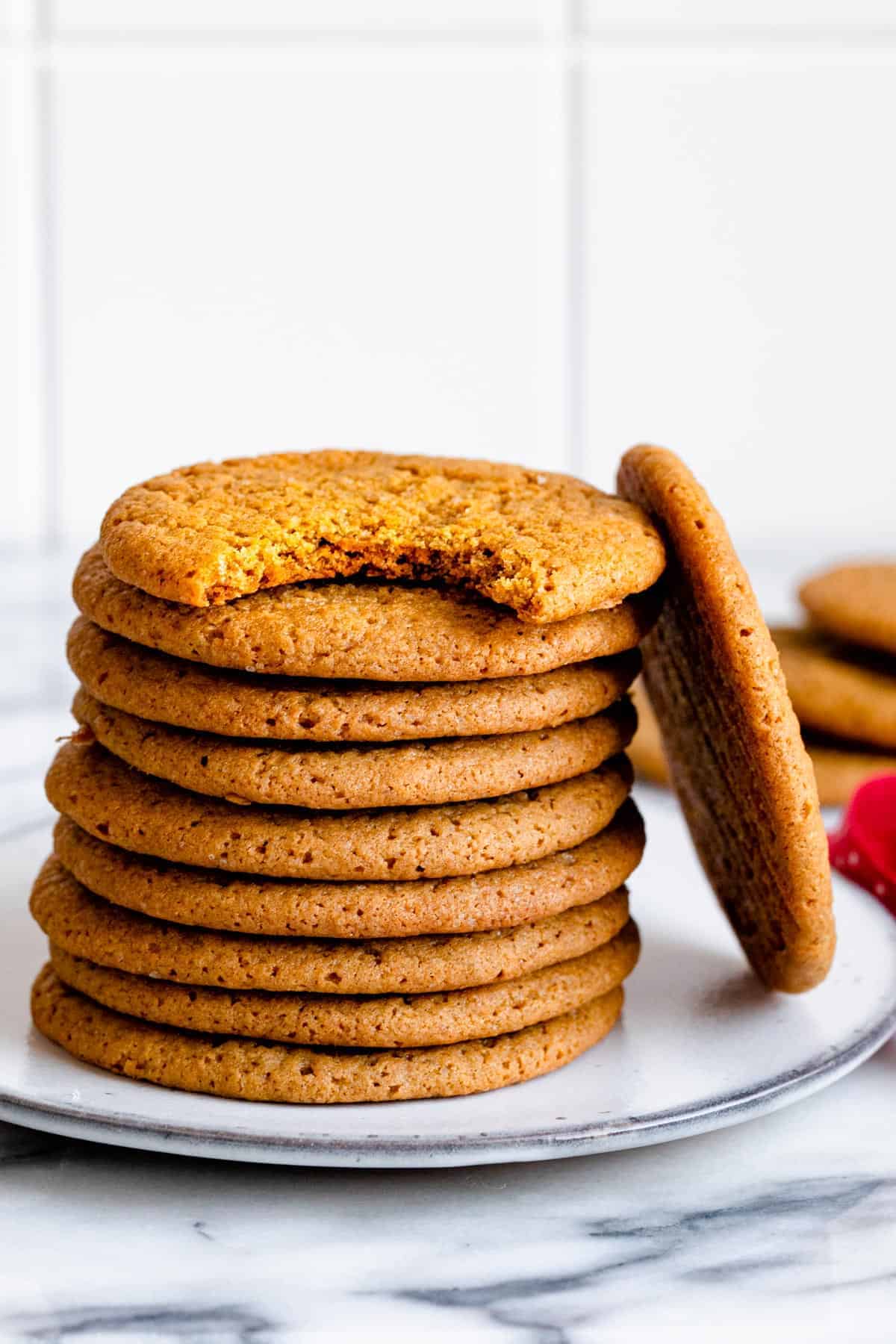 Stack of cardamom spiced cookies on a small plate