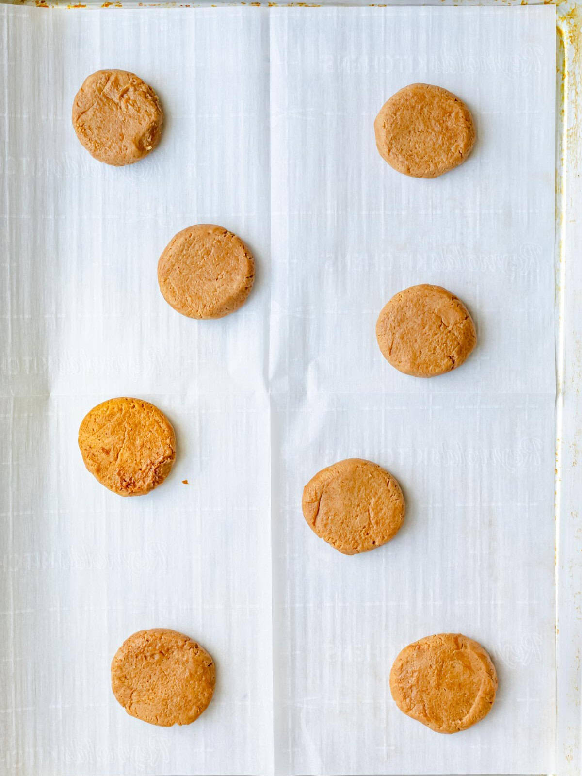 Cookies on cookie sheet before baking.