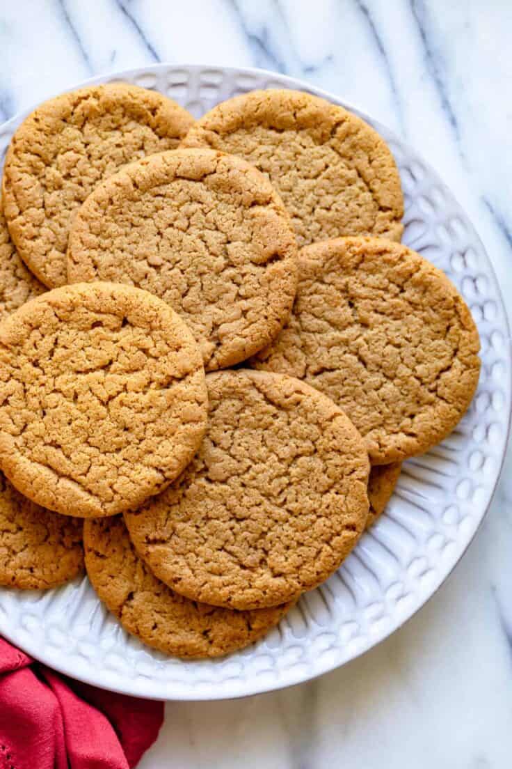 Plate of ginger snap cookies with red napkin on the side