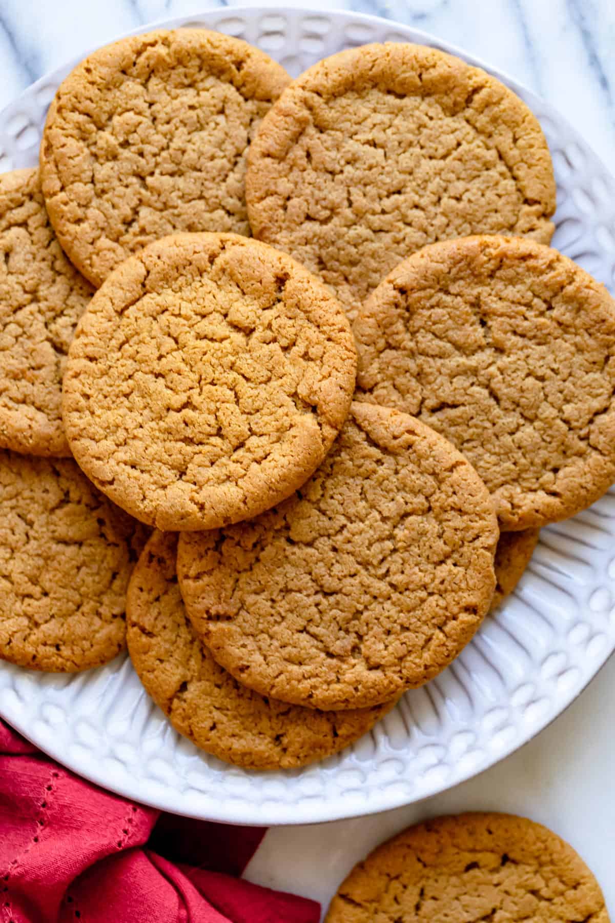 Large plate of ginger snap cookies after on marble background