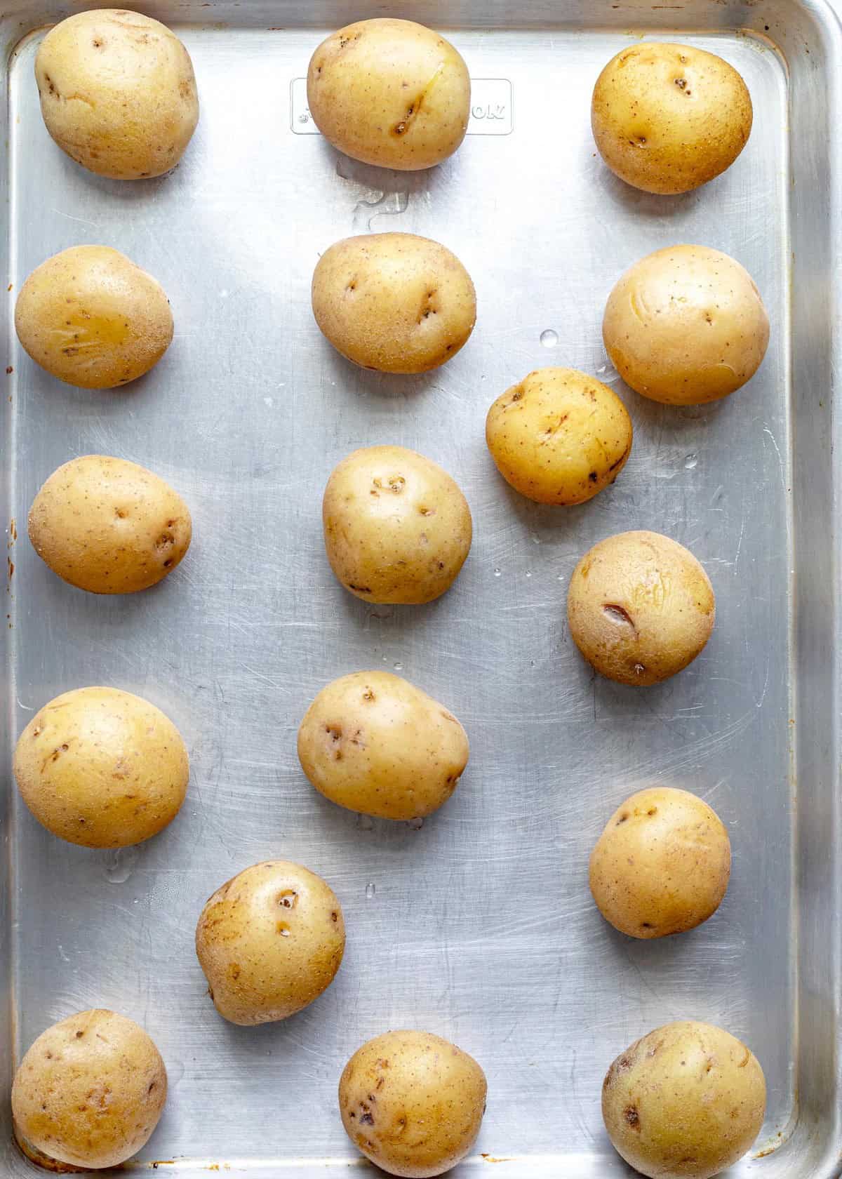 Potatoes on baking sheet.