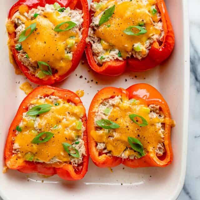 Tuna melt stuffed inside red bell peppers baked in the oven