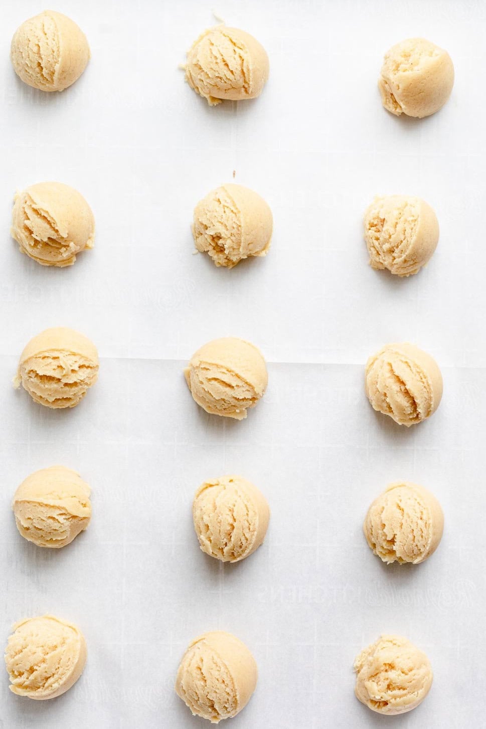 Cookies on a baking sheet before baking.