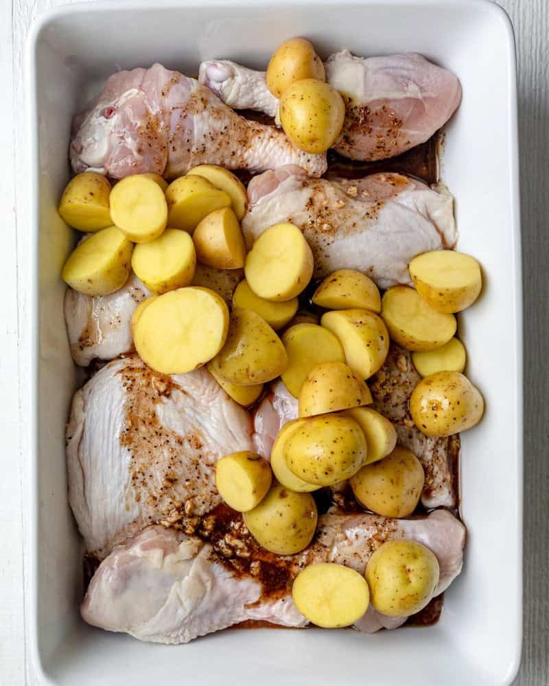 Potatoes added to baking dish.