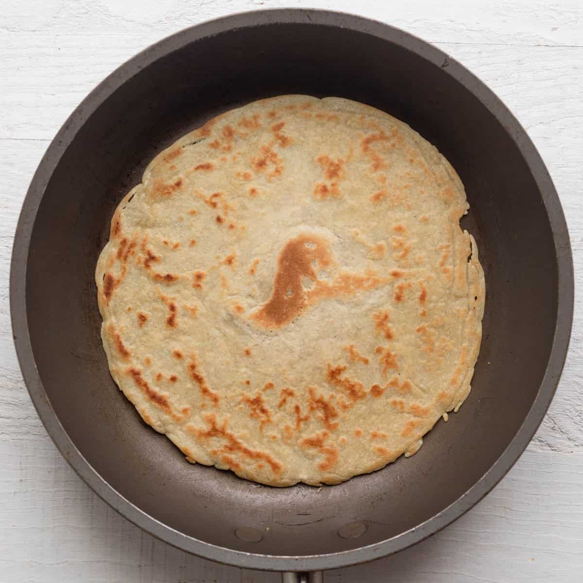 After turning the crepe to cook the other side.