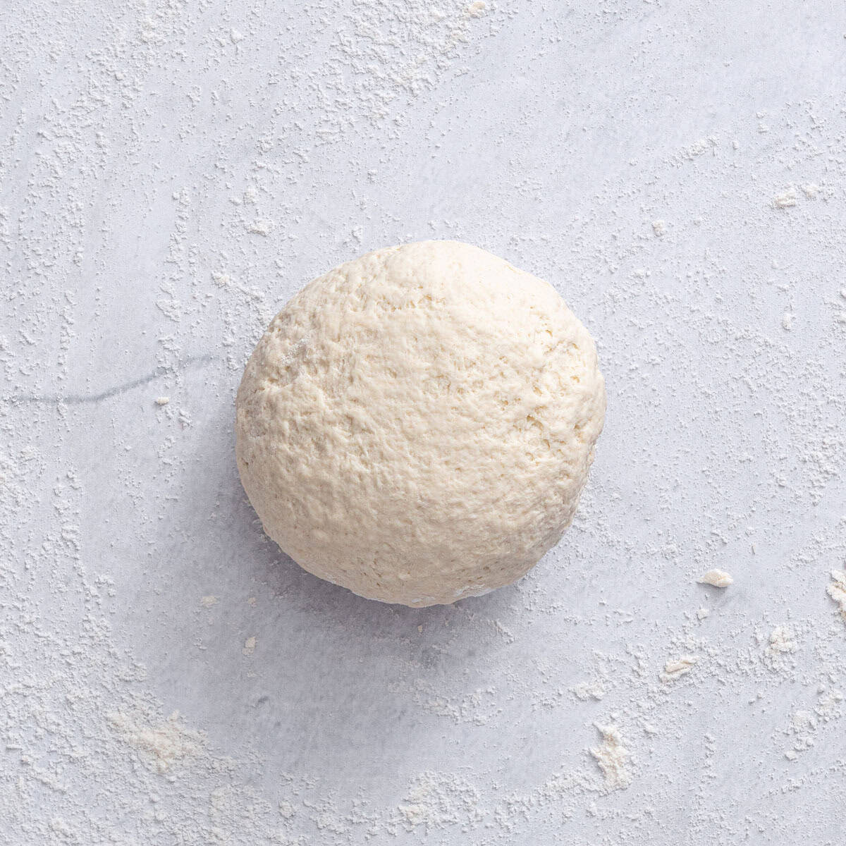 The dough after kneading until a smooth dough ball forms.