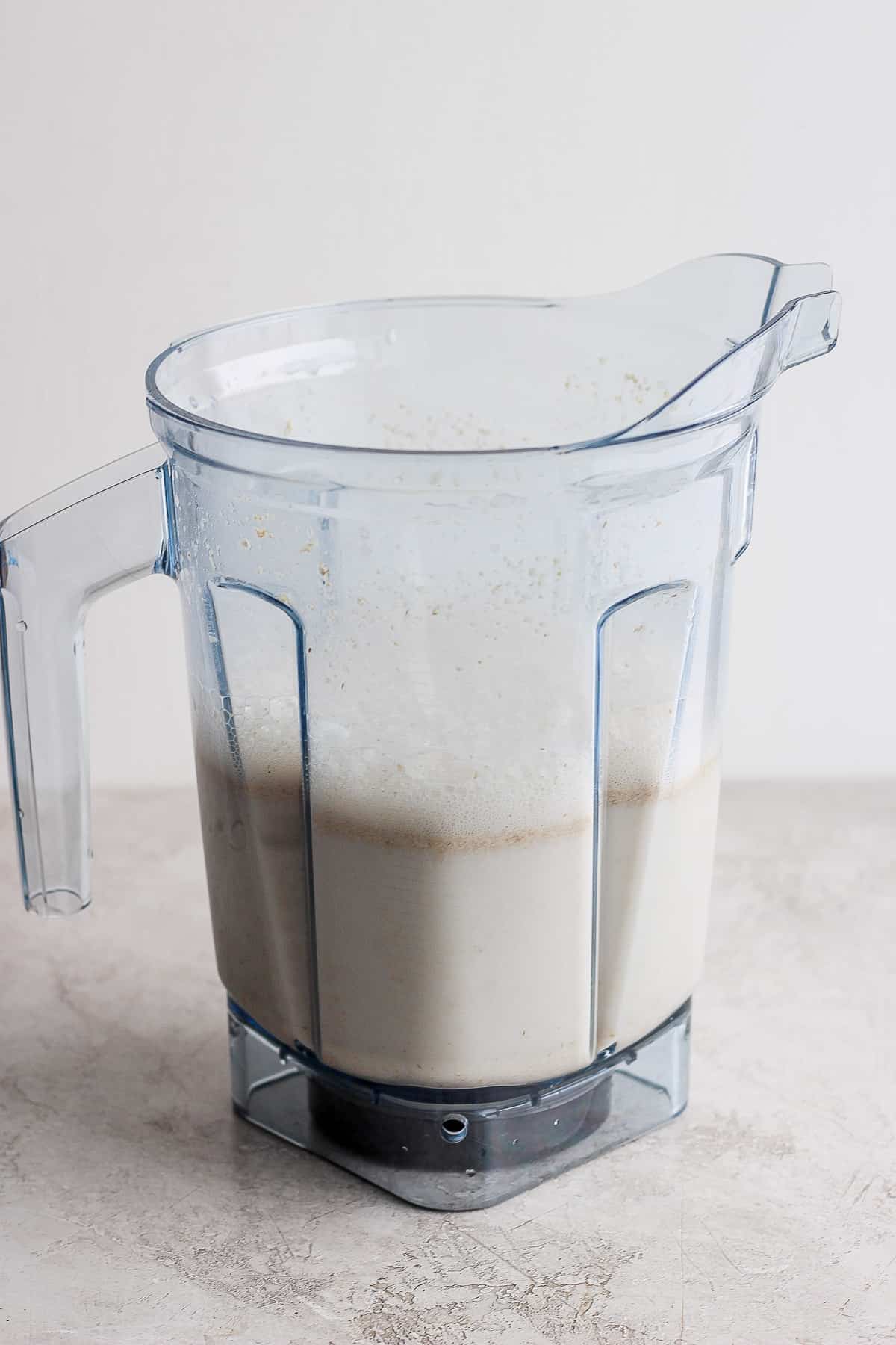 oat milk in a blender after blending oats and water