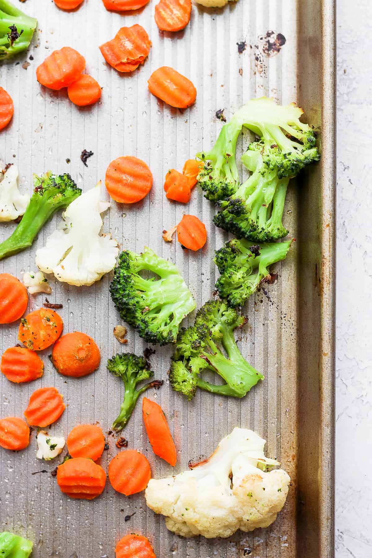 Close up of roasted vegetables on a sheet pan